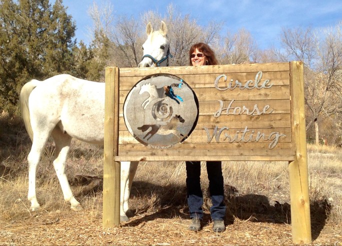 Malak and Kaf by Circle Horse Writing Sign (hiding behind)